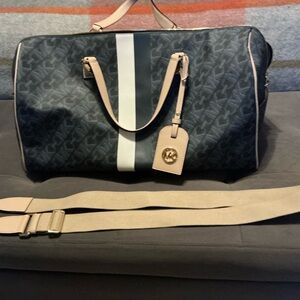 Michael Kors carry-on bag.
